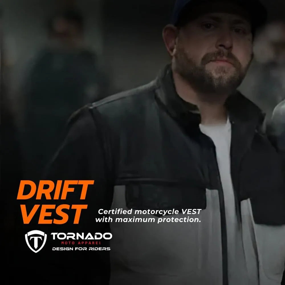 Man wearing a black motorcycle vest with Tornado Auto Apparel branding.