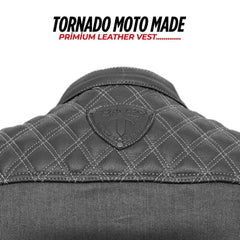 Gray leather vest with quilted pattern and brand logo on a white background