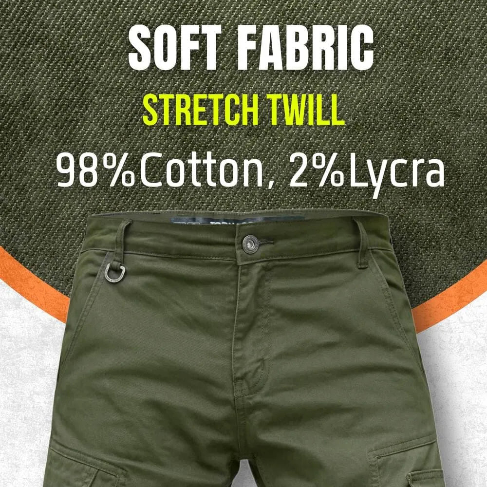 Olive green motorcycle jeans with fabric details on a textured background