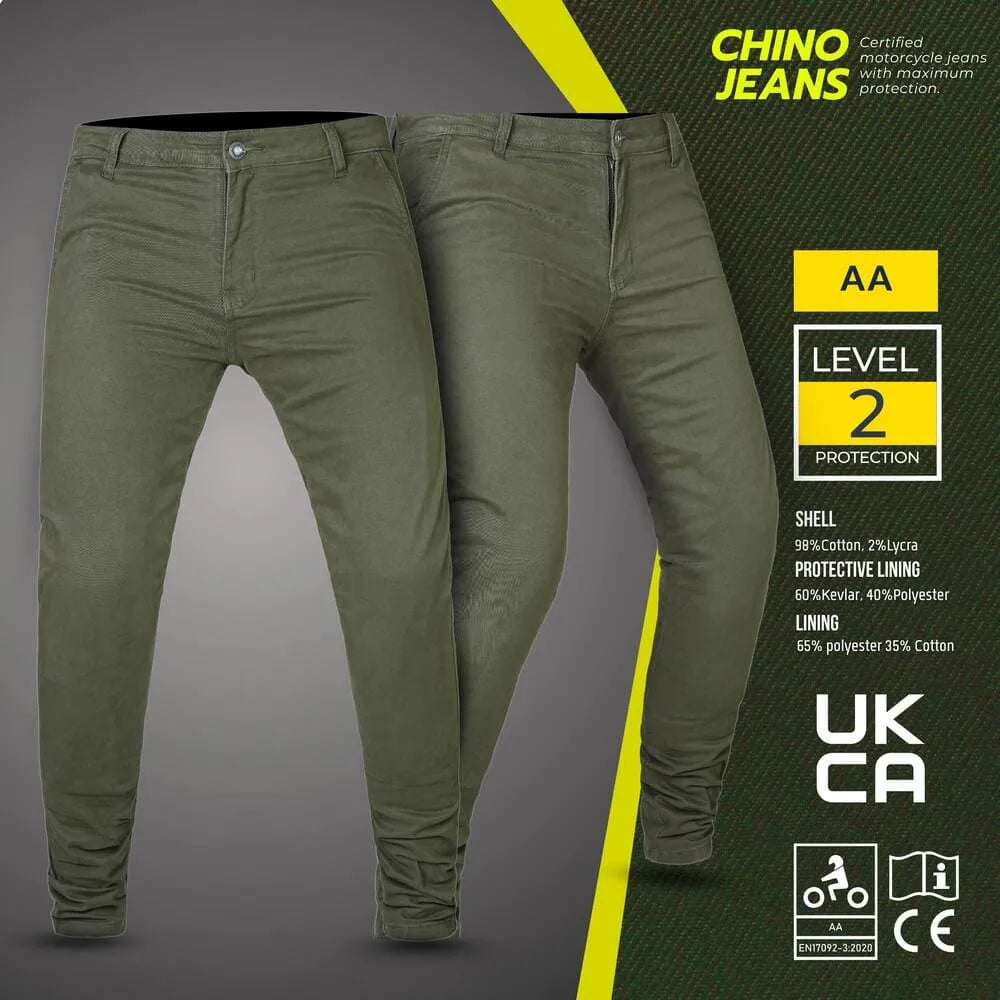 Green chino jeans with certification labels on a gray background