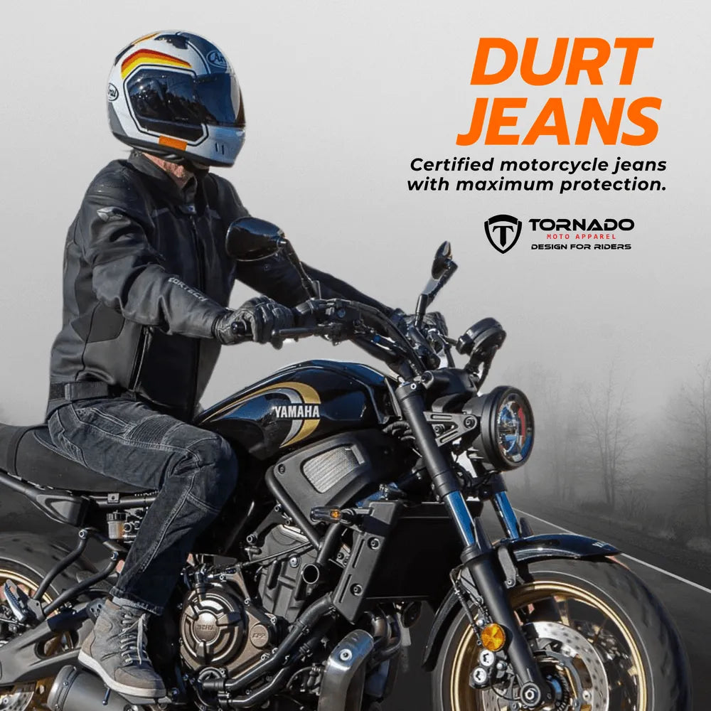 Rider wearing Tornado black motorcycle jeans with protective Kevlar lining and CE armor, perfect for motorcycle safety.